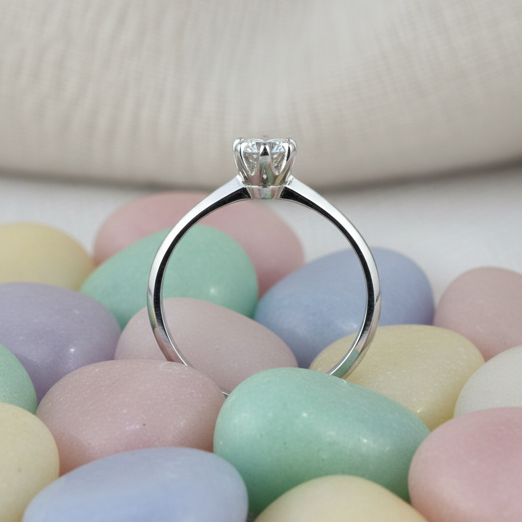 Solitaire Ring Side View on Pastel Rocks